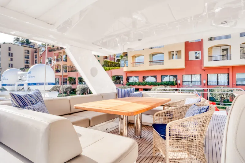  Yacht Photos Pics Luxurious seating area on 2016 Princess 68 yacht with modern decor and waterfront view.