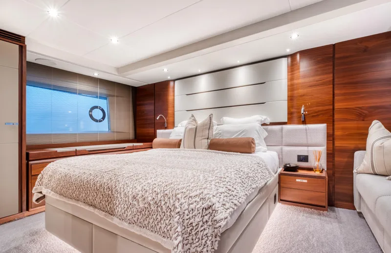  Yacht Photos Pics Luxurious bedroom interior of 2016 Princess 68 yacht with modern design and elegant furnishings.