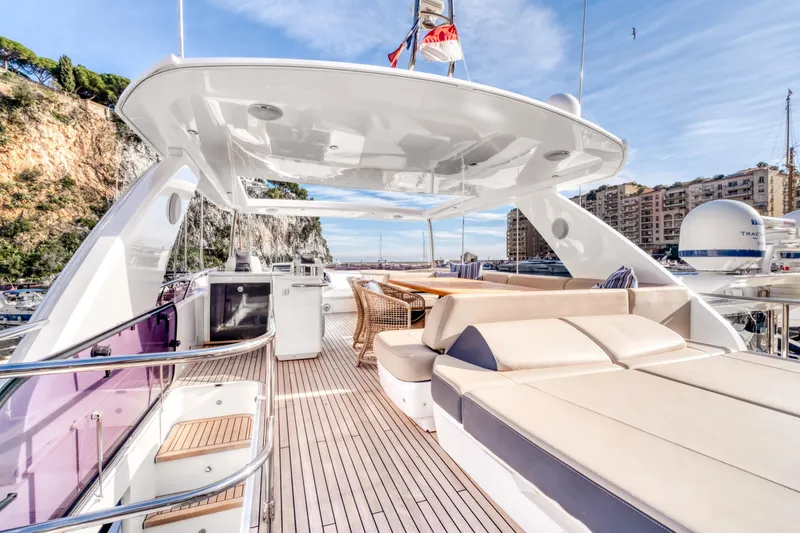  Yacht Photos Pics Luxurious 2016 Princess 68 yacht deck with elegant seating and scenic marina view.