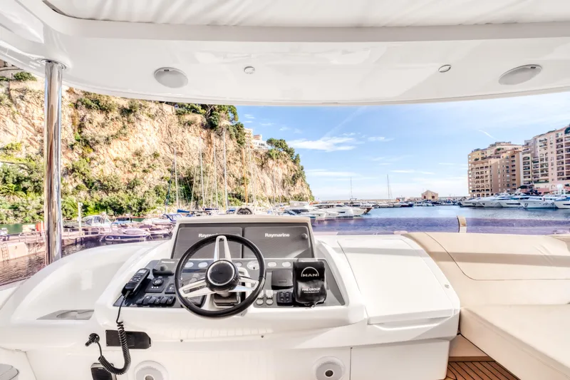  Yacht Photos Pics 2016 Princess 68 yacht helm with scenic marina view.