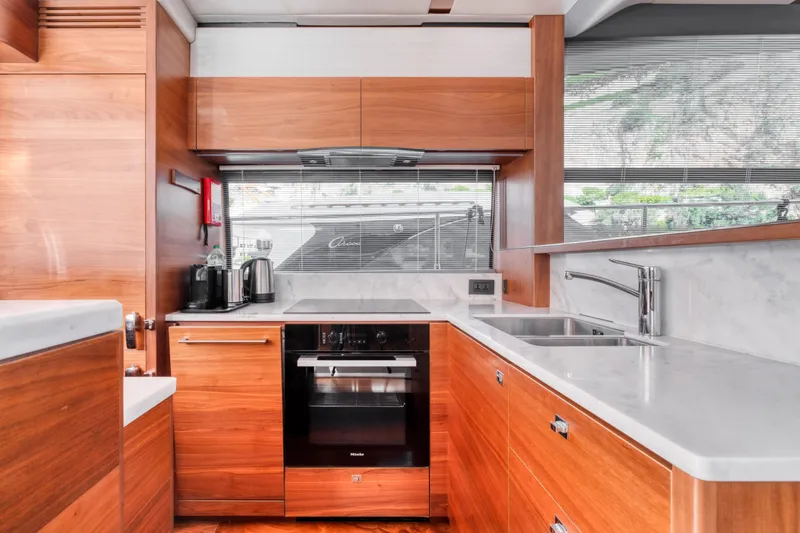  Yacht Photos Pics Luxurious kitchen interior on a 2016 Princess 68 yacht with modern appliances.