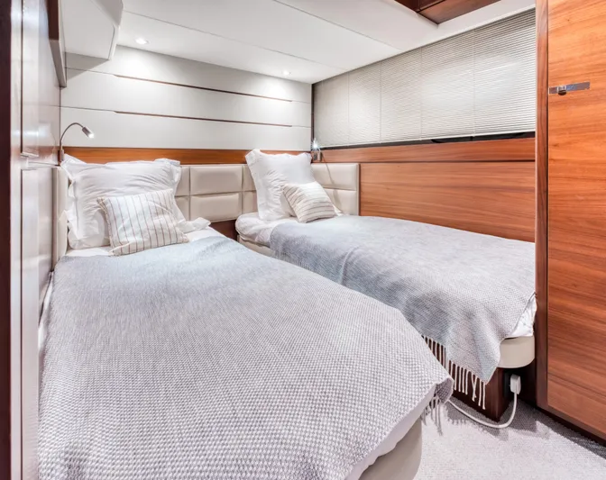  Yacht Photos Pics Luxurious twin cabin on 2016 Princess 68 yacht with modern decor and cozy bedding.