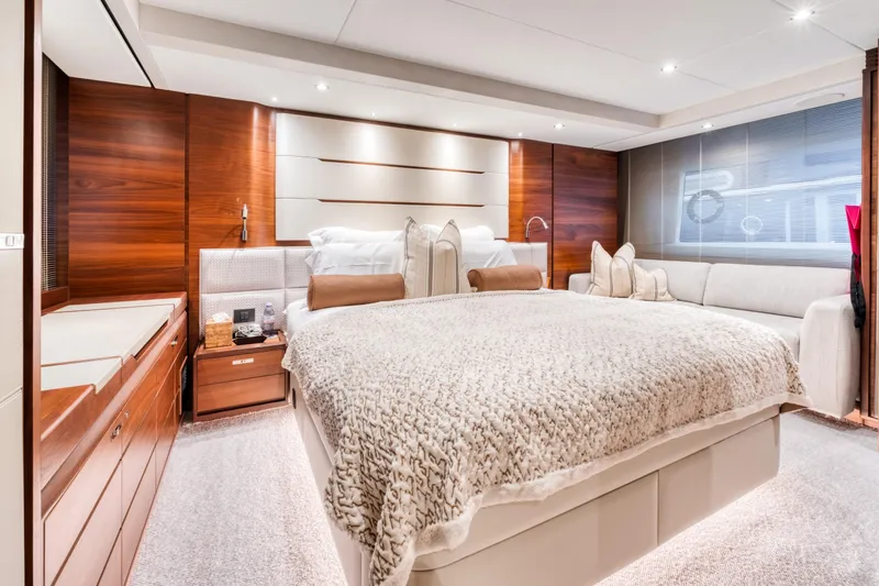  Yacht Photos Pics Luxurious bedroom interior on 2016 Princess 68 yacht with elegant wood paneling.