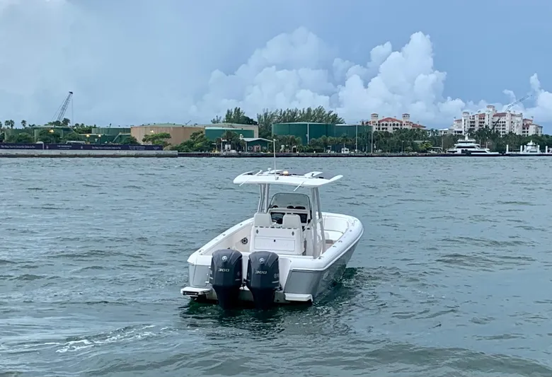  Yacht Photos Pics 2012 Intrepid 327 Center Console boat with twin engines on the water.