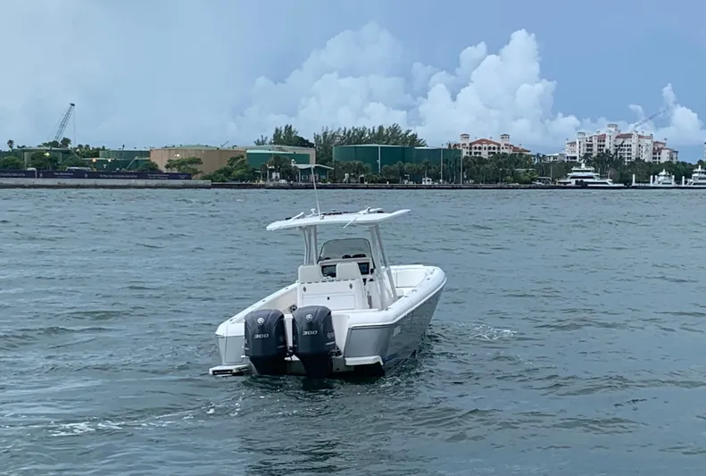  Yacht Photos Pics 2012 Intrepid 327 Center Console boat on water with twin 300 HP engines.