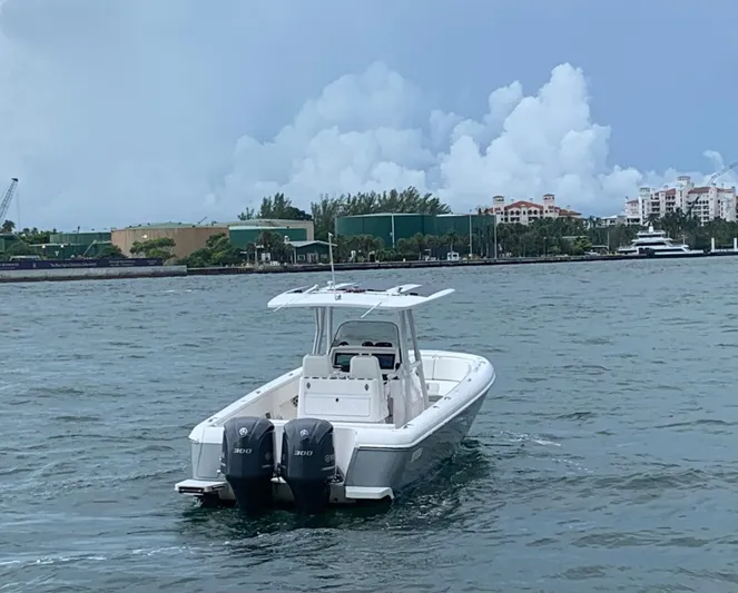  Yacht Photos Pics 2012 Intrepid 327 Center Console boat on water with twin 300 HP engines.