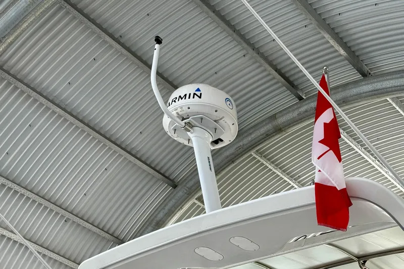 Pier Pressure Yacht Photos Pics Radar and Canadian flag on 1999 Bayliner 3788 Command Bridge Motoryacht under metal roof.