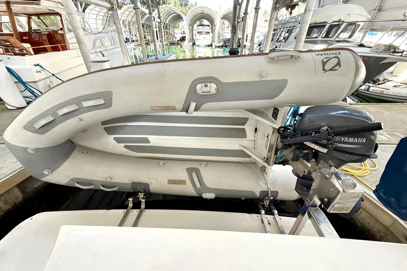 Pier Pressure Yacht Photos Pics 1999 Bayliner 3788 Command Bridge Motoryacht with inflatable dinghy and Yamaha outboard motor.