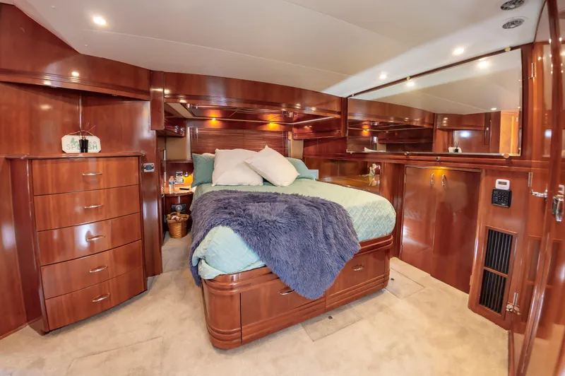 Spring Break Yacht Photos Pics Luxurious master bedroom in 2004 Carver 56 Voyager SE yacht with wood cabinetry.