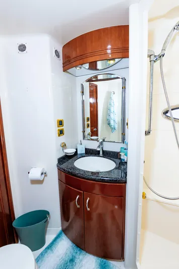 Spring Break Yacht Photos Pics 2004 Carver 56 Voyager SE bathroom with sink, mirror, and shower.