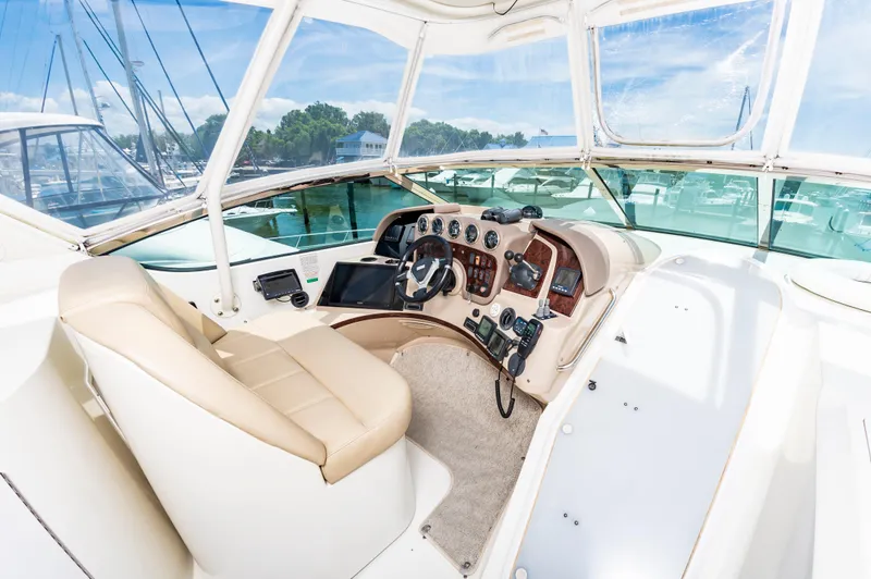 Spring Break Yacht Photos Pics 2004 Carver 56 Voyager SE helm station with leather captain's chair and navigation controls.