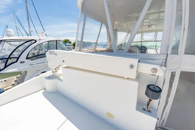 Spring Break Yacht Photos Pics 2004 Carver 56 Voyager SE yacht deck with clear canopy and docked boats.