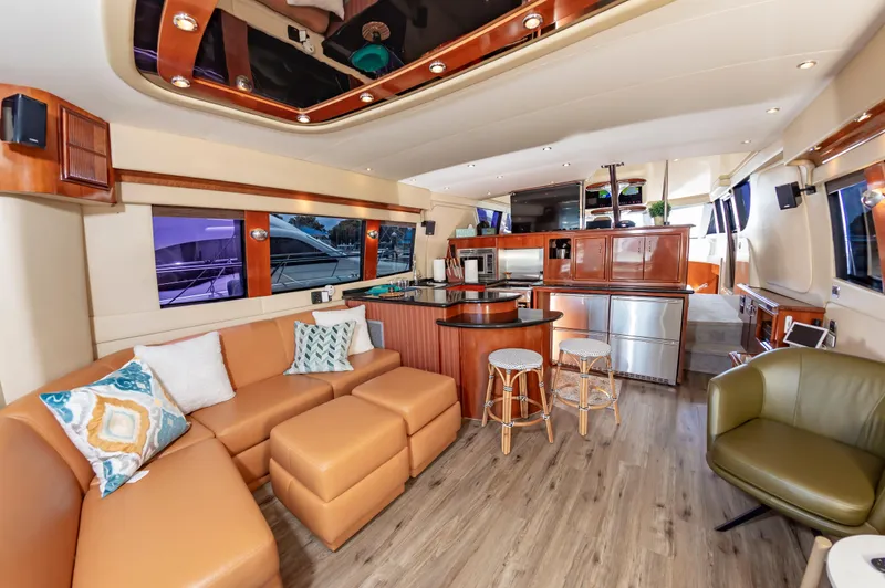 Spring Break Yacht Photos Pics Luxurious interior of a 2004 Carver 56 Voyager SE yacht with modern furnishings.