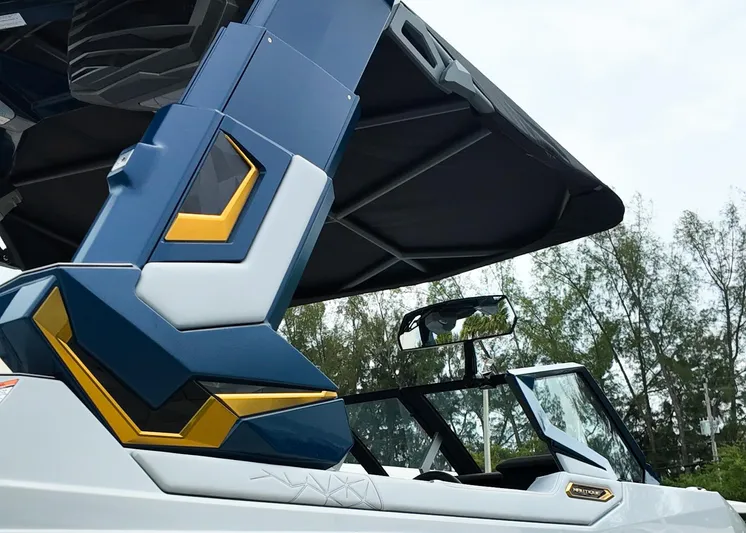  Yacht Photos Pics 2025 Nautique G23 Paragon boat with sleek design and modern features, set against a natural backdrop.