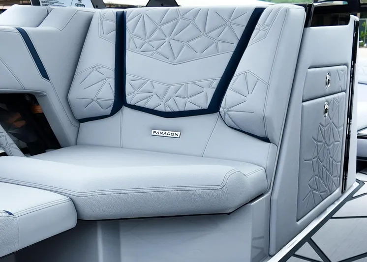  Yacht Photos Pics 2025 Nautique G23 Paragon boat interior with geometric-patterned seating.