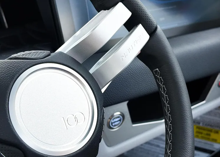  Yacht Photos Pics 2025 Nautique G23 Paragon steering wheel with sleek design and detailed stitching.
