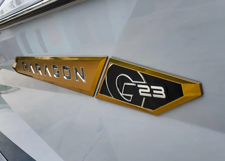  Yacht Photos Pics 2025 Nautique G23 Paragon logo on sleek boat exterior.