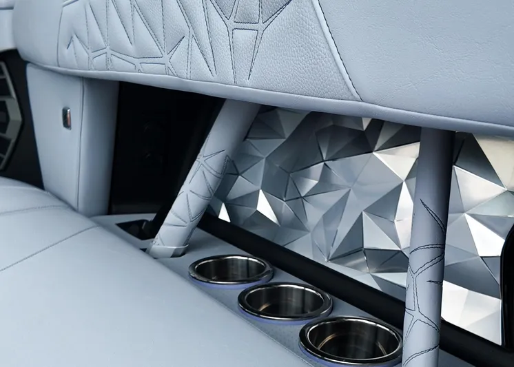  Yacht Photos Pics 2025 Nautique G23 Paragon interior with geometric design and cup holders.