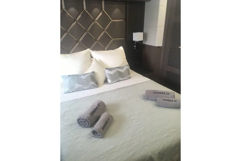  Yacht Photos Pics Luxurious bedroom interior on 2018 Galeon 640 Fly yacht with elegant bedding and towels.