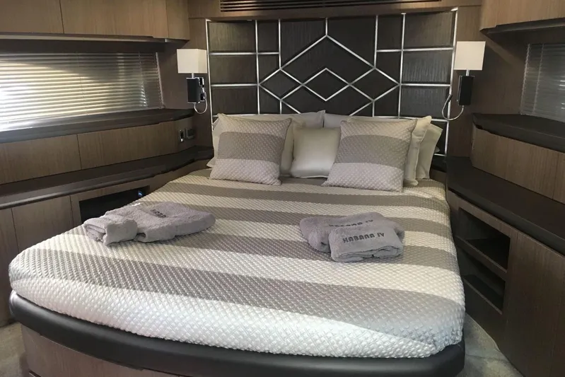  Yacht Photos Pics Luxurious bedroom interior of 2018 Galeon 640 Fly yacht with modern design elements.