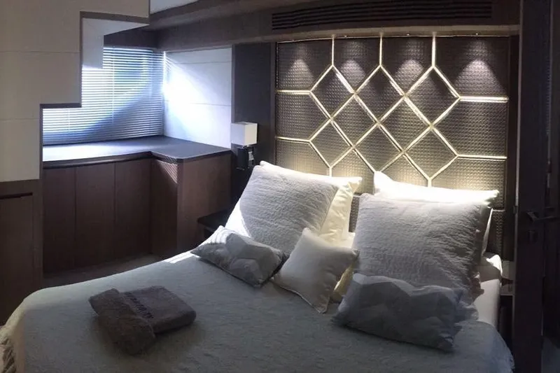  Yacht Photos Pics Luxurious bedroom interior on 2018 Galeon 640 Fly yacht with elegant lighting and modern design.