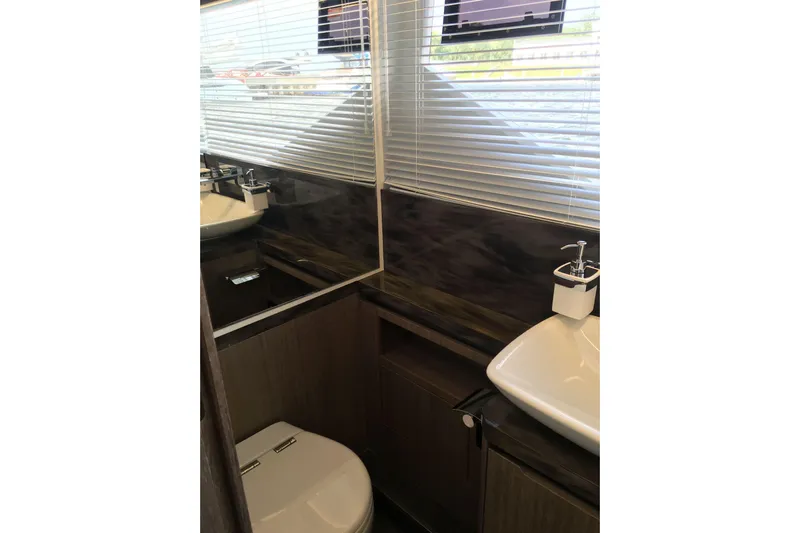  Yacht Photos Pics Luxurious bathroom interior of 2018 Galeon 640 Fly yacht with modern fixtures.