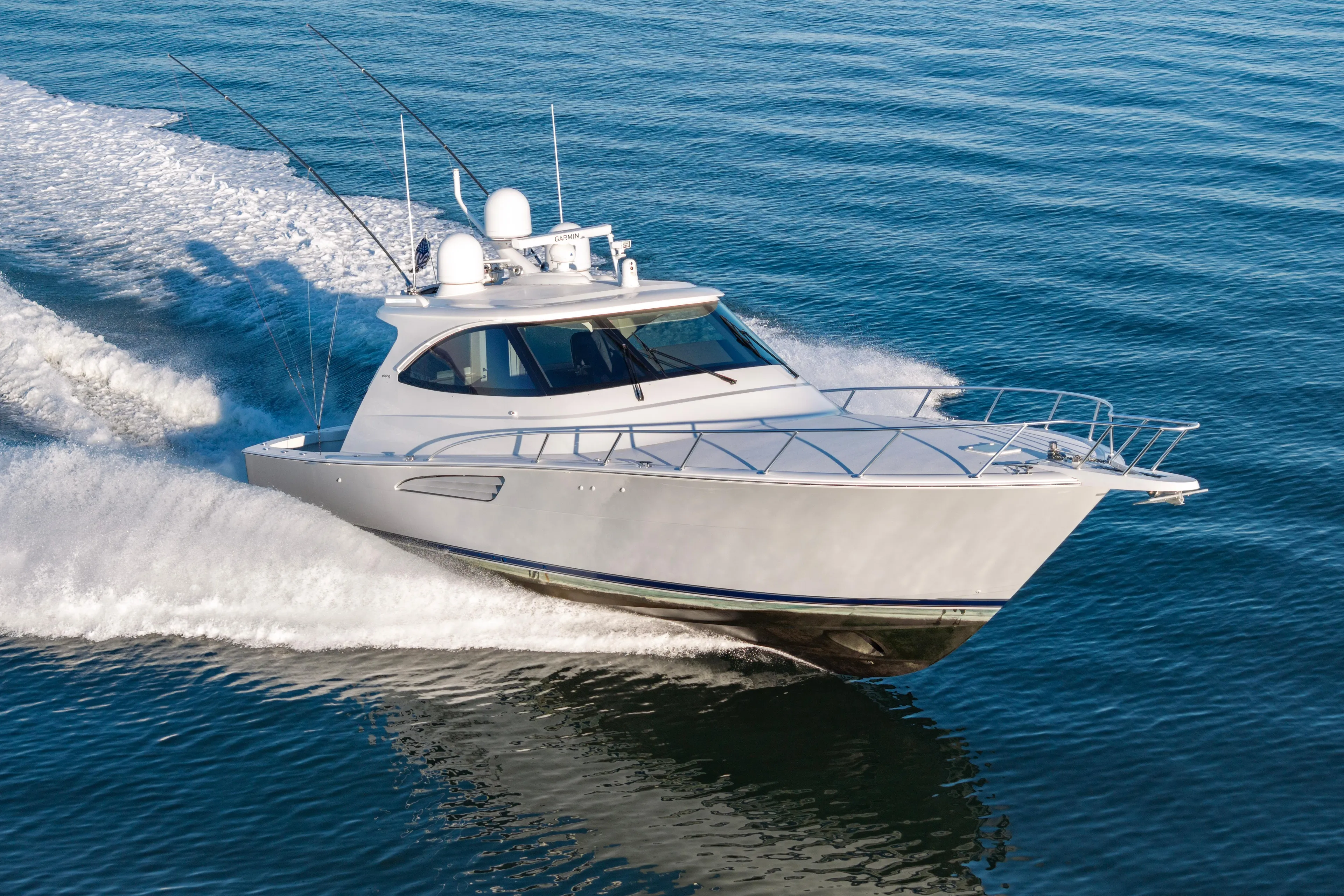 What A Country Yacht Photos Pics 2022 Viking 54 Sport Coupe cruising on open water, showcasing sleek design and performance.