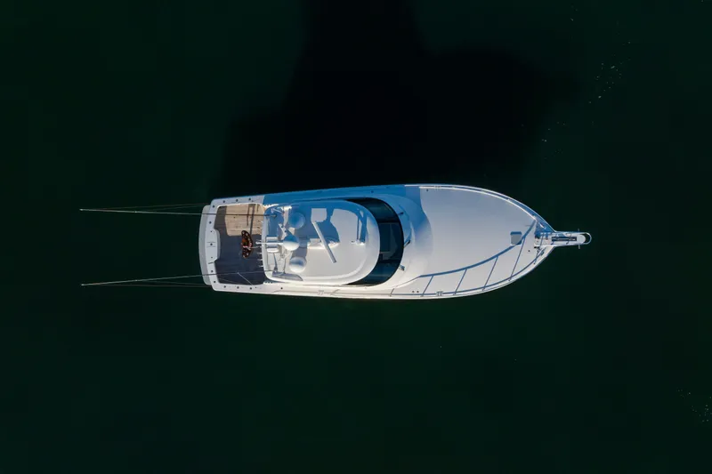 What A Country Yacht Photos Pics Aerial view of 2022 Viking 54 Sport Coupe yacht on dark water.