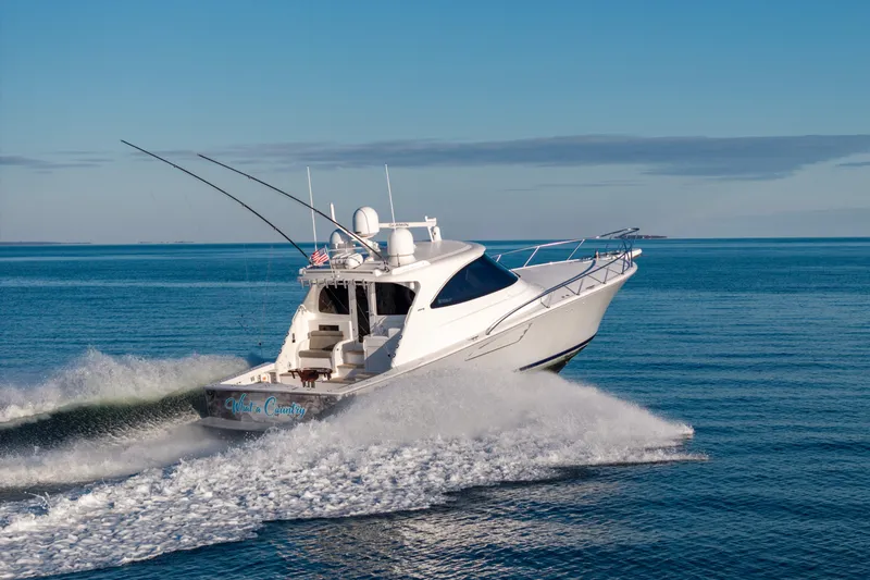 What A Country Yacht Photos Pics 2022 Viking 54 Sport Coupe cruising on open water.