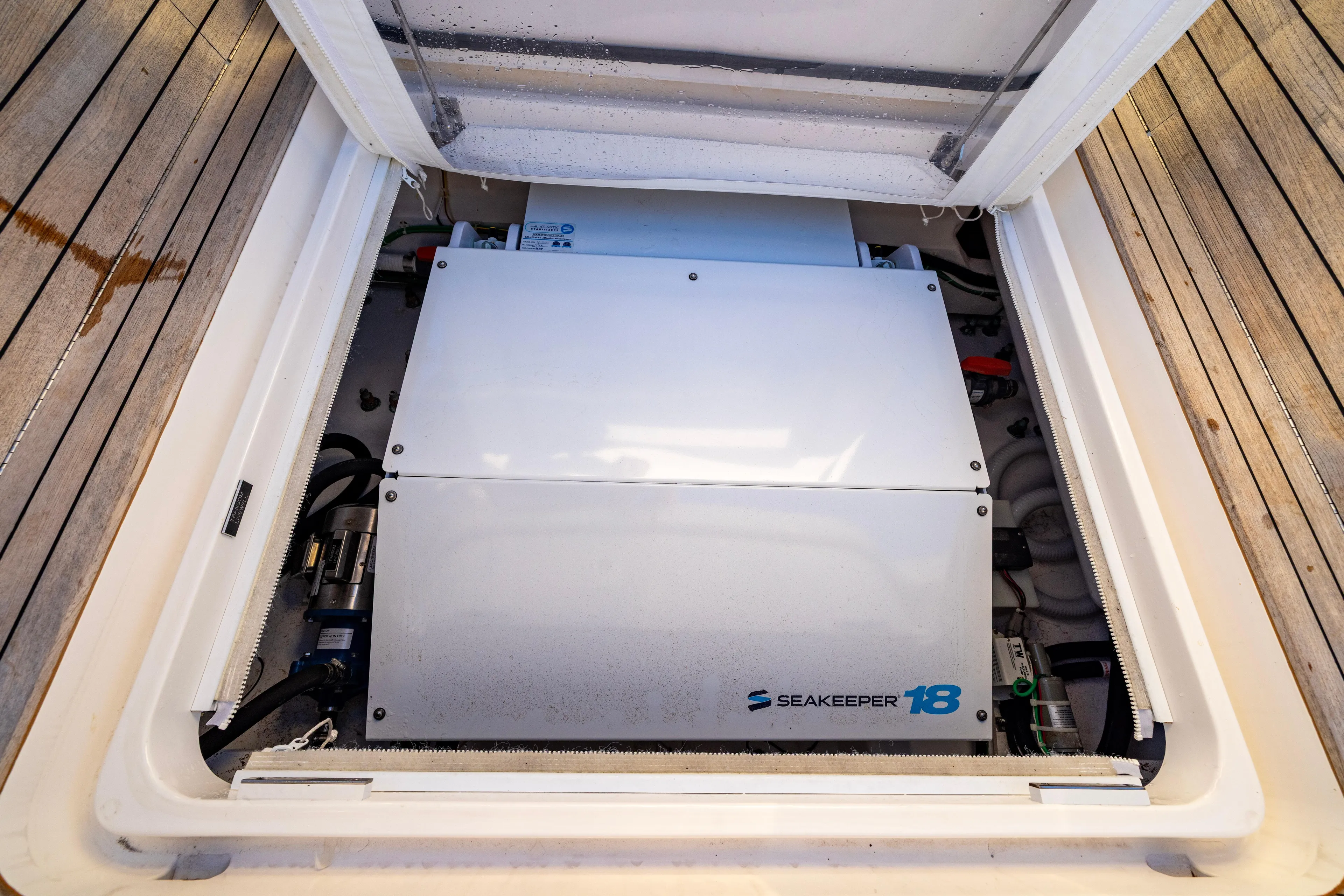 What A Country Yacht Photos Pics Seakeeper 18 gyrostabilizer in 2022 Viking 54 Sport Coupe yacht engine compartment.