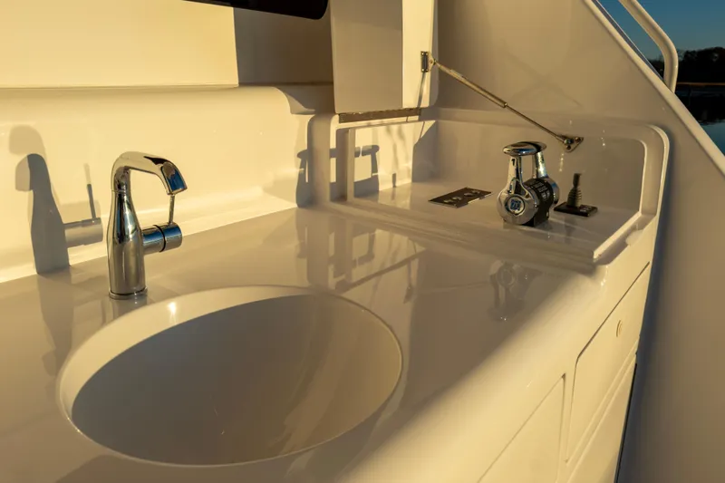 What A Country Yacht Photos Pics Luxury sink and controls on 2022 Viking 54 Sport Coupe yacht deck.