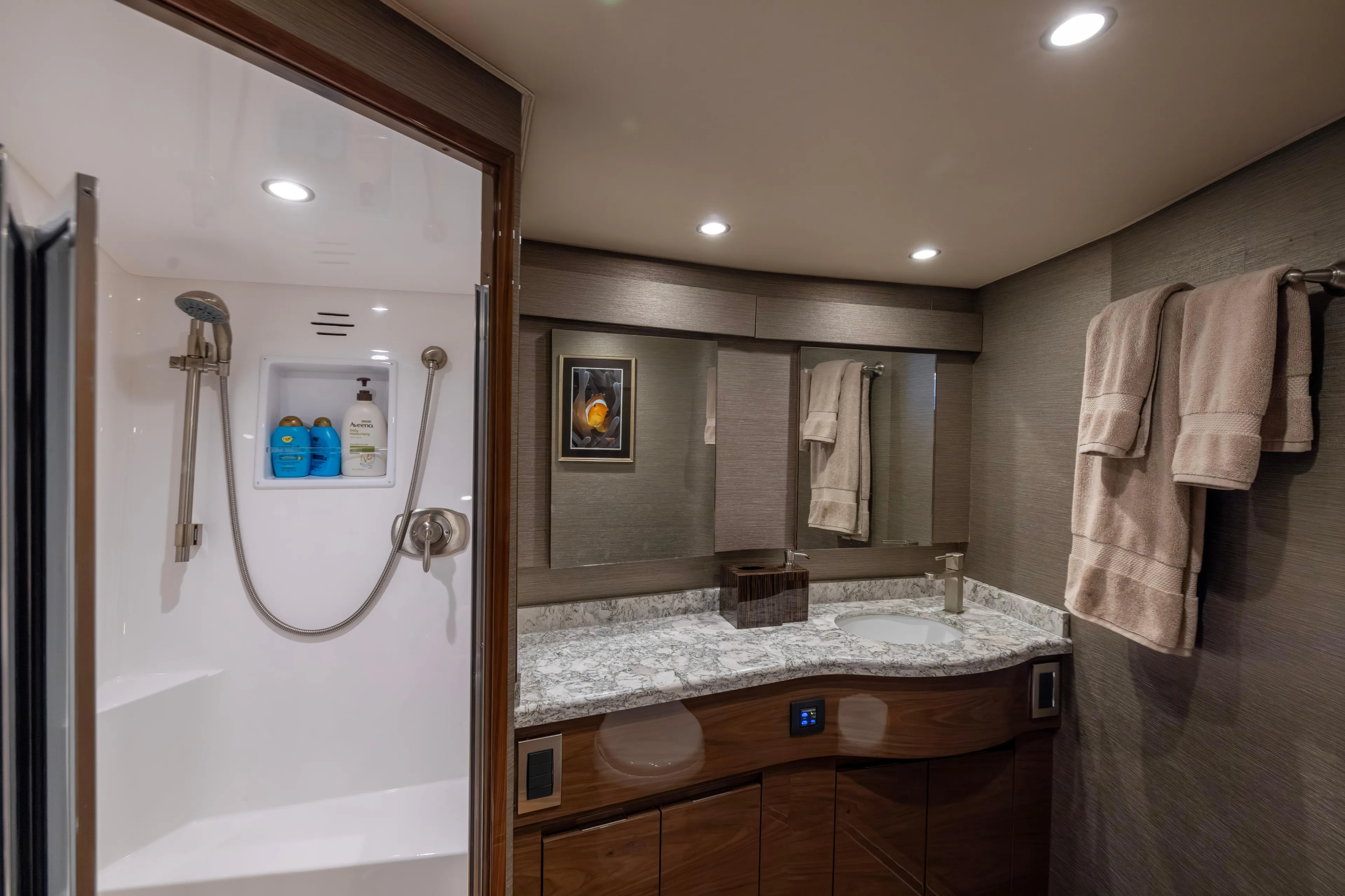 What A Country Yacht Photos Pics Luxurious bathroom in 2022 Viking 54 Sport Coupe yacht with modern shower and elegant vanity.