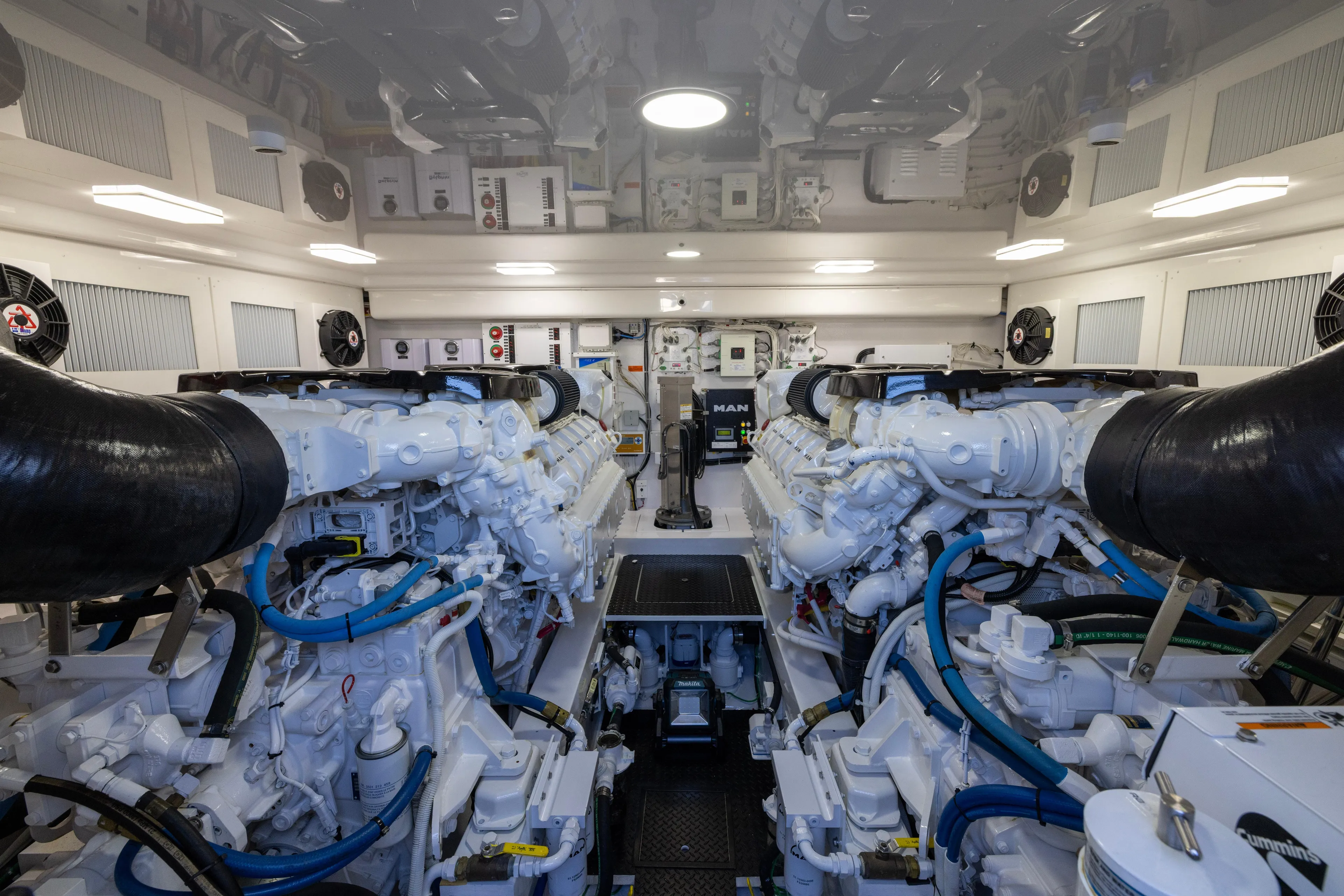 What A Country Yacht Photos Pics Engine room of 2022 Viking 54 Sport Coupe, featuring advanced machinery and systems.