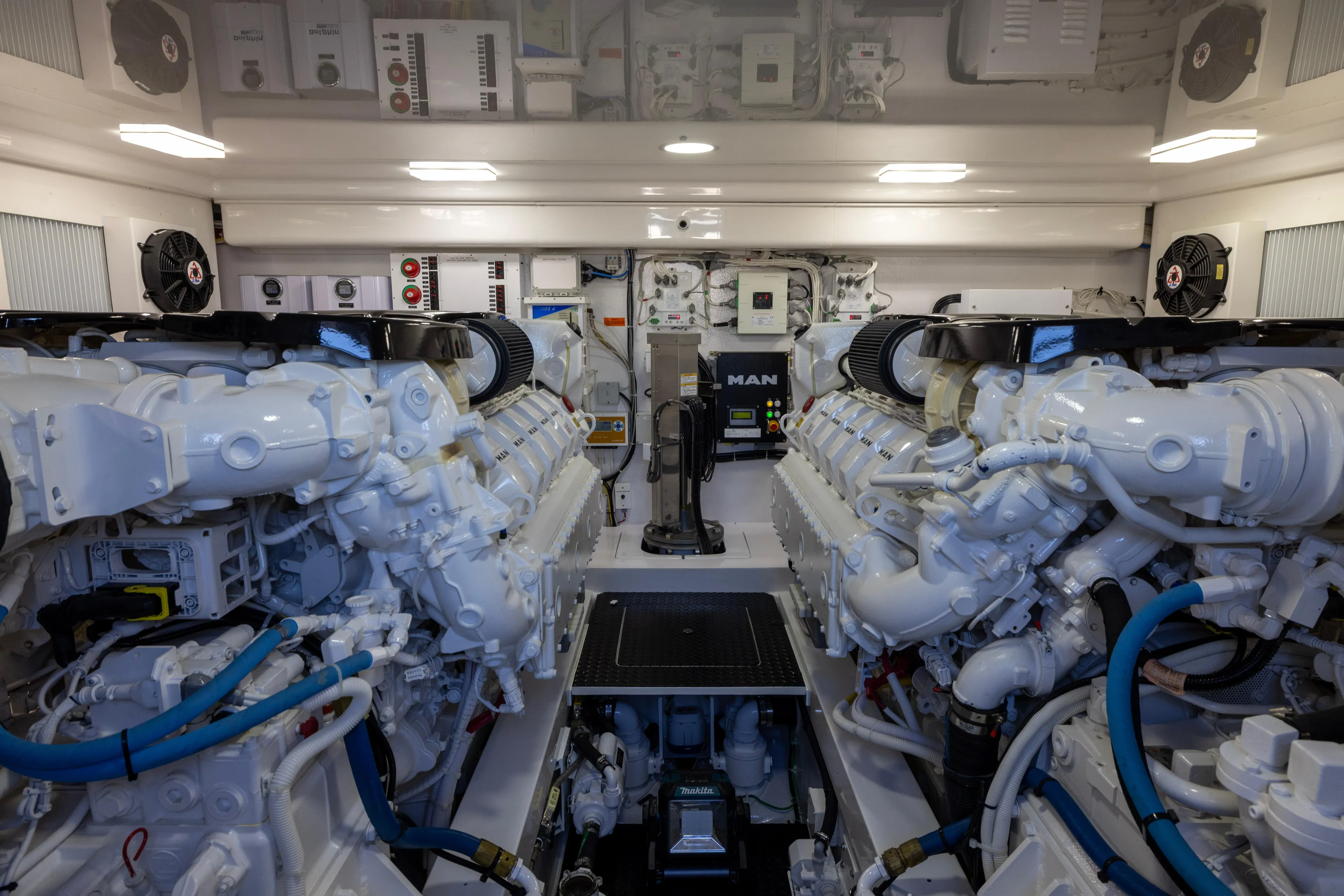 What A Country Yacht Photos Pics Engine room of 2022 Viking 54 Sport Coupe, featuring dual MAN engines and advanced systems.