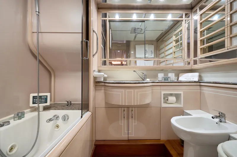  Yacht Photos Pics Luxurious bathroom in 1992 Posillipo Technema 82 yacht with modern fixtures and elegant design.