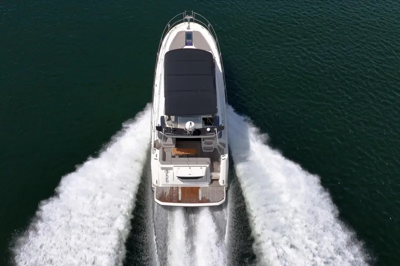 Kedem Plus Yacht Photos Pics Aerial view of 2021 Beneteau Monte Carlo 52 yacht cruising on water.