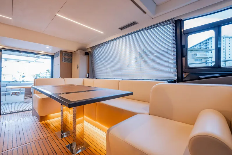Kedem Plus Yacht Photos Pics Luxurious interior of 2021 Beneteau Monte Carlo 52 yacht with elegant seating and modern design.