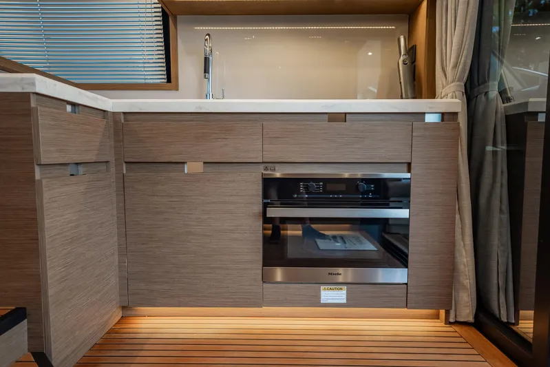 Kedem Plus Yacht Photos Pics Modern kitchen in 2021 Beneteau Monte Carlo 52 yacht with Miele oven and sleek cabinetry.