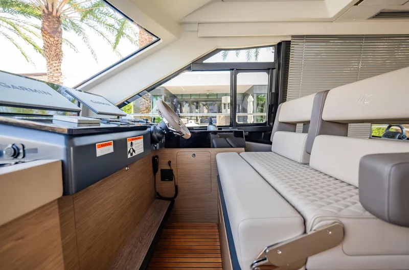 Kedem Plus Yacht Photos Pics Interior of 2021 Beneteau Monte Carlo 52 yacht with modern helm and seating.