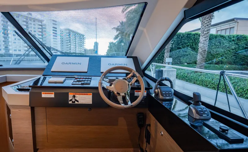 Kedem Plus Yacht Photos Pics Helm station of 2021 Beneteau Monte Carlo 52 yacht with Garmin navigation systems.