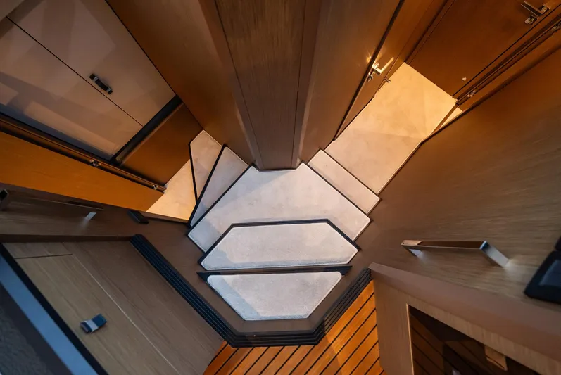 Kedem Plus Yacht Photos Pics Interior view of 2021 Beneteau Monte Carlo 52 yacht, showcasing modern stair design.