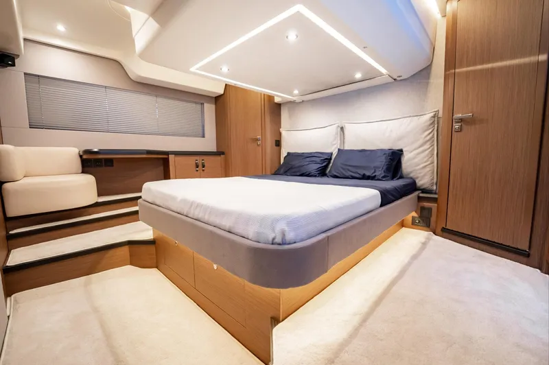 Kedem Plus Yacht Photos Pics Luxurious bedroom interior of 2021 Beneteau Monte Carlo 52 yacht, featuring modern design and cozy ambiance.