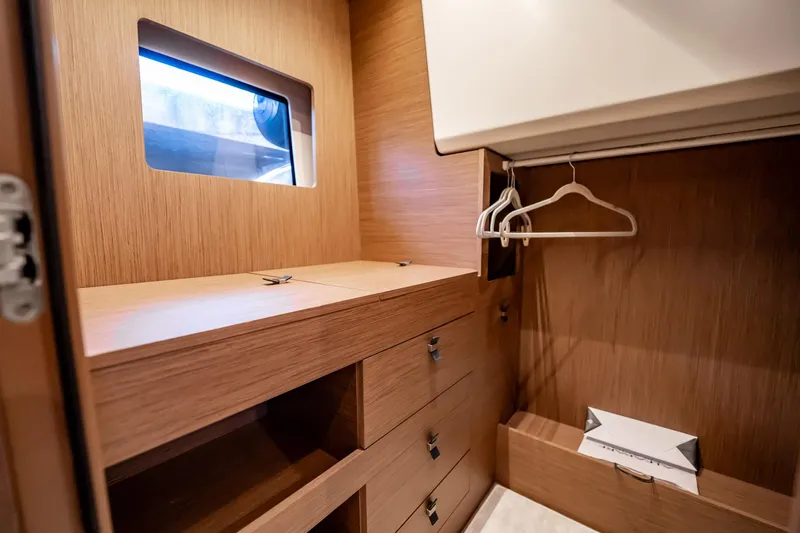 Kedem Plus Yacht Photos Pics Luxurious wooden closet interior on 2021 Beneteau Monte Carlo 52 yacht.