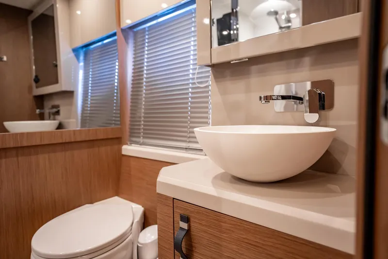 Kedem Plus Yacht Photos Pics Luxurious bathroom in 2021 Beneteau Monte Carlo 52 yacht with modern fixtures.