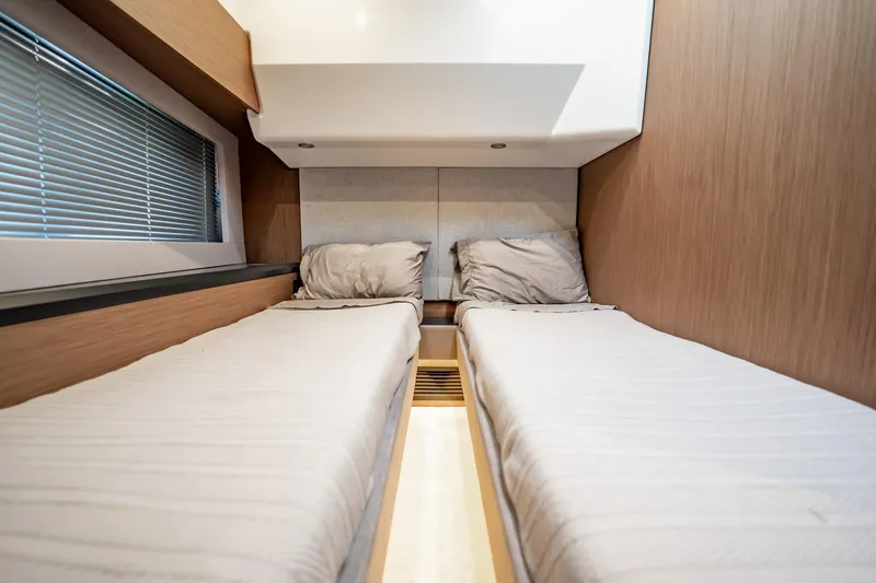 Kedem Plus Yacht Photos Pics Twin beds in the cabin of a 2021 Beneteau Monte Carlo 52 yacht.