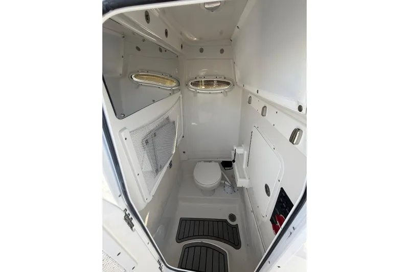  Yacht Photos Pics 2025 Sea Hunt Escape 28 boat interior bathroom with modern fixtures and compact design.