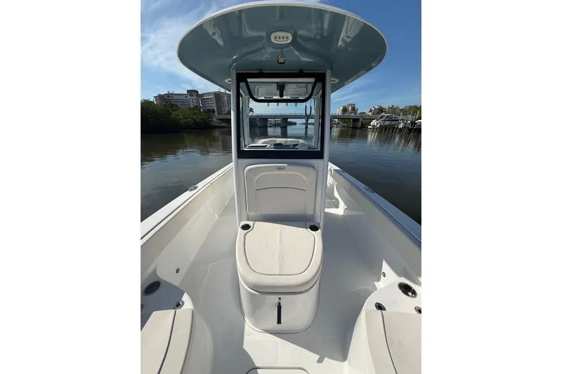  Yacht Photos Pics 2025 Sea Hunt Escape 28 boat interior with console, on calm water.