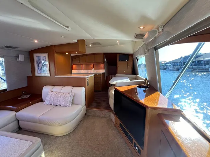 Reel Interest Yacht Photos Pics Luxurious interior of 2002 Ocean Yachts 56 Super Sport with elegant seating and waterfront view.