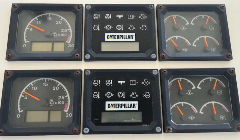 Reel Interest Yacht Photos Pics Instrument panel of a 2002 Ocean Yachts 56 Super Sport with Caterpillar gauges.