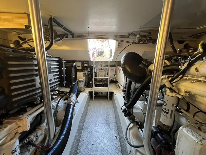 Reel Interest Yacht Photos Pics Engine room of 2002 Ocean Yachts 56 Super Sport, showcasing machinery and equipment.